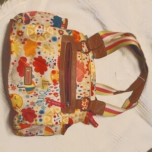 Lily Bloom bag sunshine yellow pink and teal on tan background. Fun!